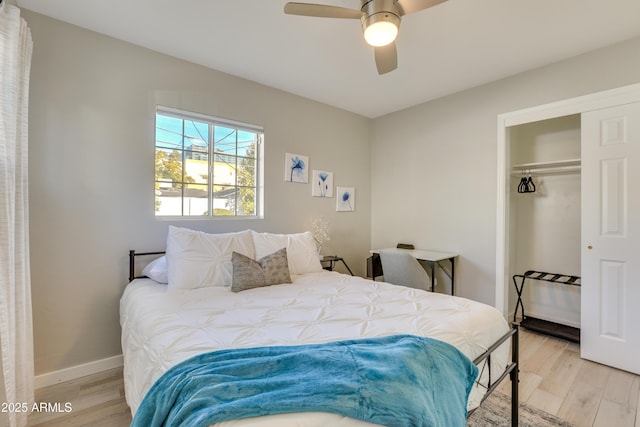 bedroom with a closet, ceiling fan, and light hardwood / wood-style flooring