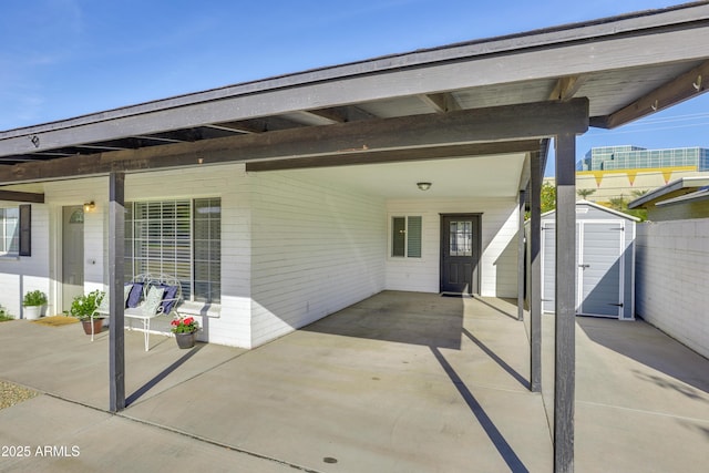 view of patio featuring a storage shed