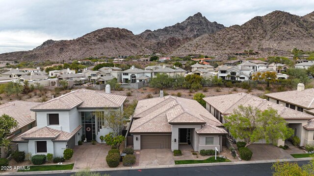 3120 E Squaw Peak Cir, Phoenix, AZ 85016 - view of front of house featuring a garage, a residential view, concrete driveway, and stucco siding