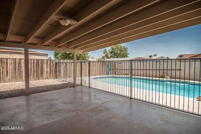 view of swimming pool with a patio area