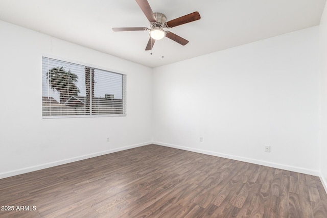 unfurnished room featuring ceiling fan and dark hardwood / wood-style flooring