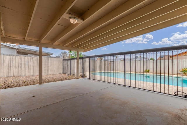 view of patio / terrace with a fenced in pool