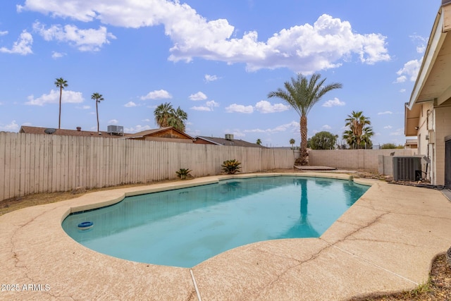 view of pool with central AC unit and a patio area