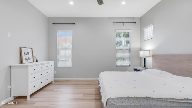 bedroom with recessed lighting, light wood-style flooring, and baseboards