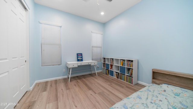 bedroom featuring baseboards, recessed lighting, wood finished floors, and a ceiling fan
