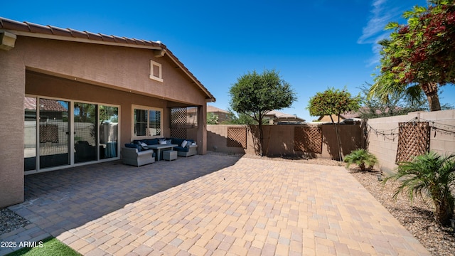 view of patio featuring outdoor lounge area and a fenced backyard