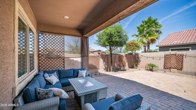 view of patio / terrace featuring an outdoor living space and fence