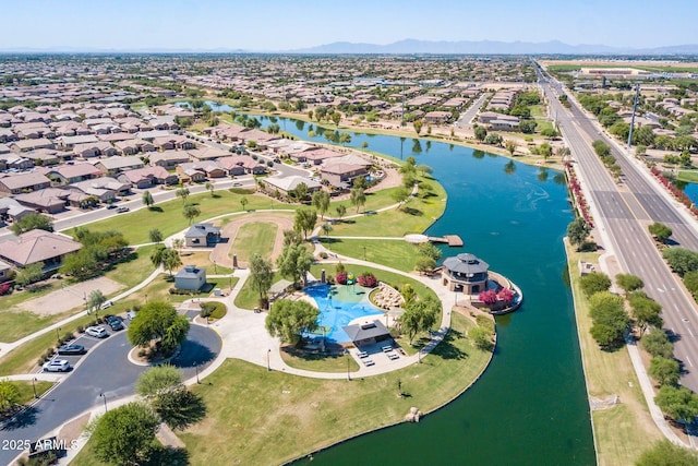 aerial view featuring a water and mountain view and a residential view