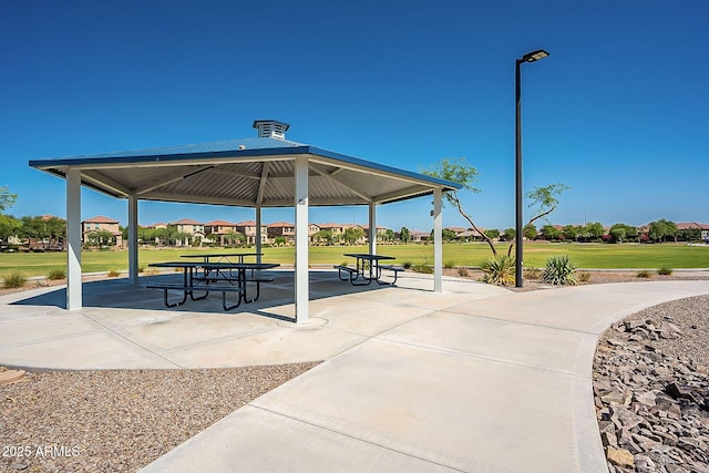 view of property's community featuring a lawn and a gazebo