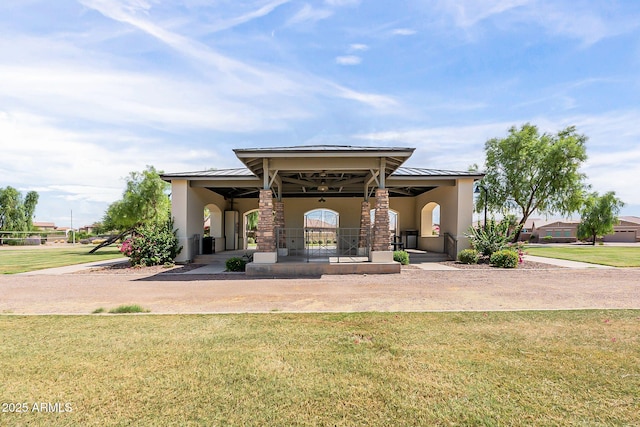 view of front of house featuring a front yard and stucco siding