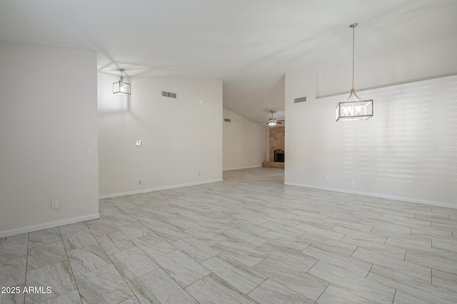 empty room with lofted ceiling and ceiling fan