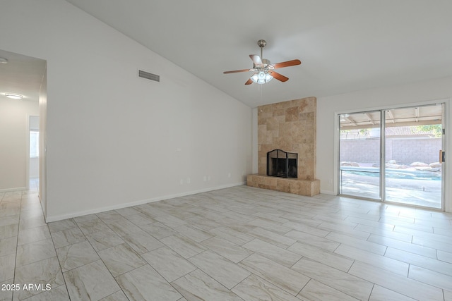 unfurnished living room with high vaulted ceiling, a large fireplace, and ceiling fan