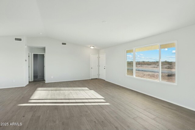 interior space featuring a barn door and dark hardwood / wood-style floors