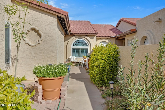 entrance to property with a patio area