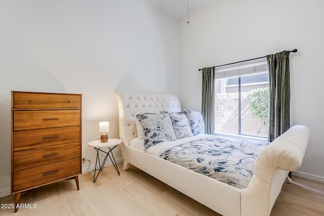 16254 N 48th Way, Scottsdale, AZ 85254 - bedroom featuring light wood-type flooring and high vaulted ceiling