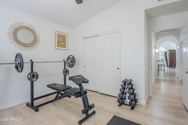 16254 N 48th Way, Scottsdale, AZ 85254 - workout area with light wood-style floors, vaulted ceiling, and arched walkways