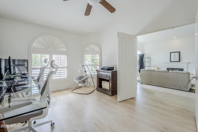16254 N 48th Way, Scottsdale, AZ 85254 - home office with light wood-style floors, ceiling fan, and a fireplace