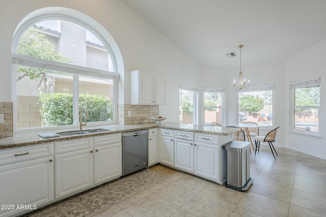 16254 N 48th Way, Scottsdale, AZ 85254 - kitchen featuring stainless steel dishwasher, plenty of natural light, decorative backsplash, and high vaulted ceiling