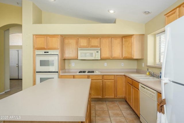9446 E Olla Ave, Mesa, AZ 85212 - kitchen with vaulted ceiling, white appliances, light countertops, arched walkways, and a sink