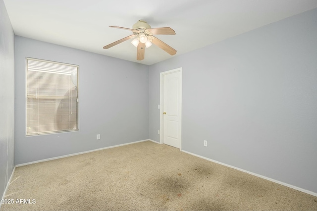 9446 E Olla Ave, Mesa, AZ 85212 - carpeted spare room featuring baseboards and a ceiling fan