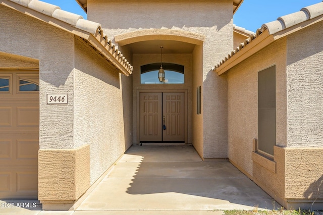 9446 E Olla Ave, Mesa, AZ 85212 - doorway to property with stucco siding and a tiled roof