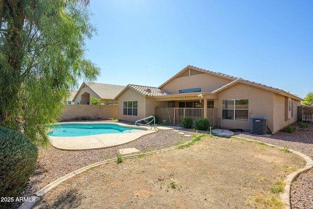 9446 E Olla Ave, Mesa, AZ 85212 - rear view of house featuring a fenced in pool, a fenced backyard, stucco siding, and central AC