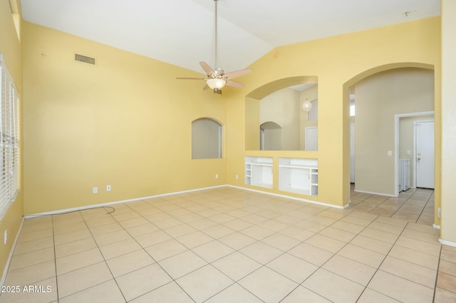 9446 E Olla Ave, Mesa, AZ 85212 - unfurnished room with ceiling fan, light tile patterned floors, arched walkways, visible vents, and vaulted ceiling