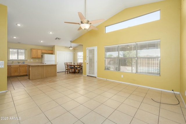 9446 E Olla Ave, Mesa, AZ 85212 - living area with high vaulted ceiling, ceiling fan, baseboards, and light tile patterned floors