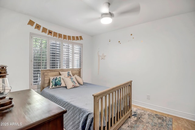 bedroom featuring baseboards and a ceiling fan