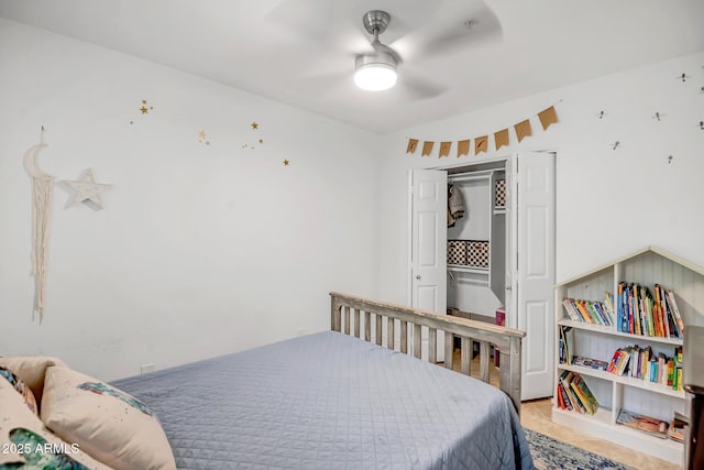 bedroom featuring ceiling fan and a closet