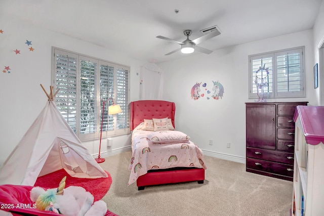 carpeted bedroom with baseboards, ceiling fan, and visible vents