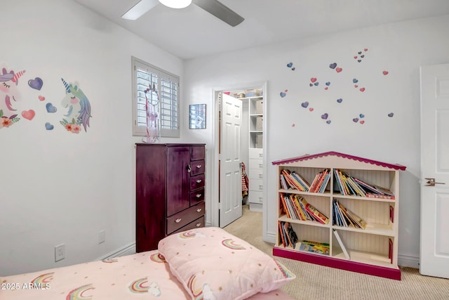bedroom featuring ensuite bathroom, ceiling fan, and light carpet