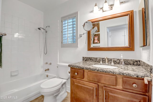 bathroom featuring vanity, shower / bath combination, and toilet