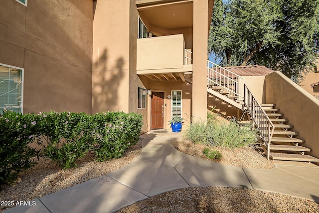 property entrance featuring stucco siding
