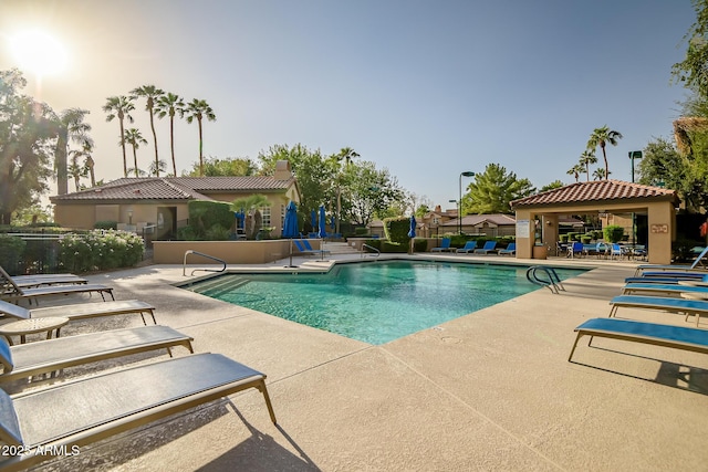 community pool featuring a patio and a gazebo