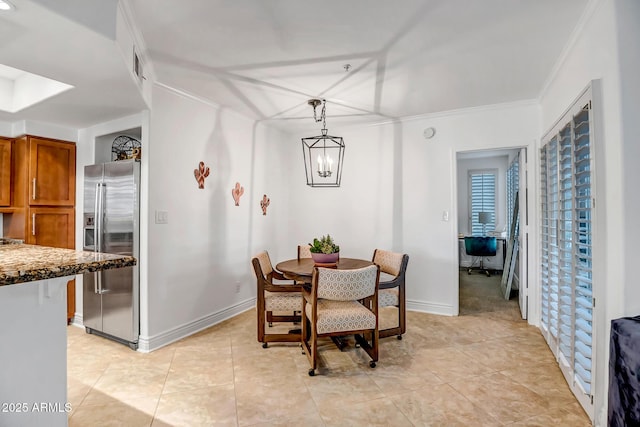dining room featuring baseboards, ornamental molding, a notable chandelier, and light tile patterned flooring