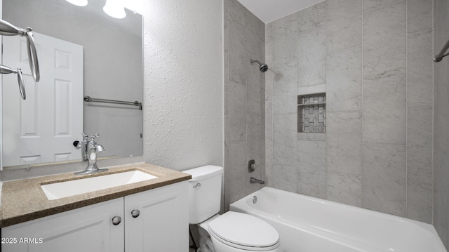 full bathroom featuring vanity, a textured wall, toilet, and shower / bathing tub combination