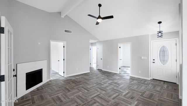 unfurnished living room featuring beam ceiling, high vaulted ceiling, a ceiling fan, baseboards, and visible vents