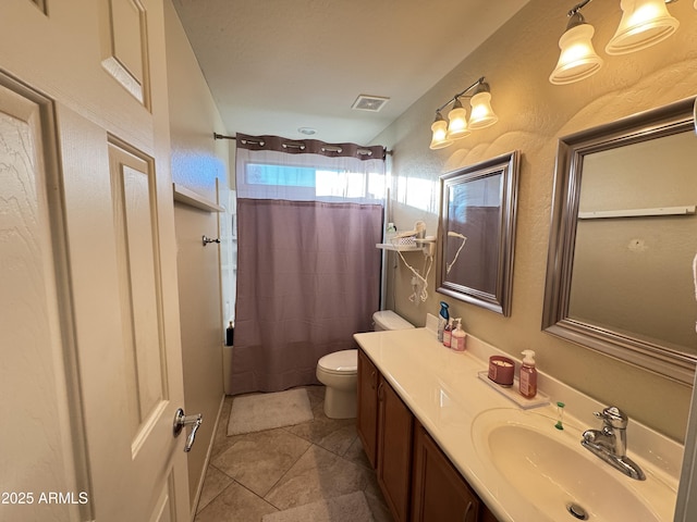 bathroom featuring vanity, tile patterned flooring, toilet, and a shower with shower curtain