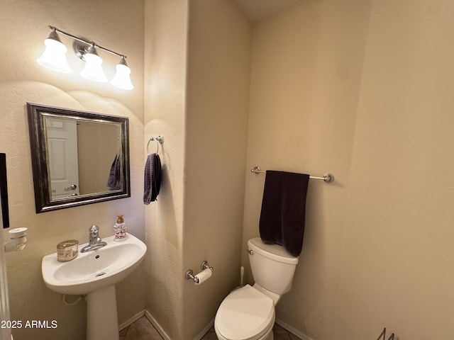 bathroom featuring toilet