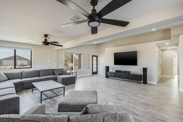 living room with ceiling fan and light hardwood / wood-style floors