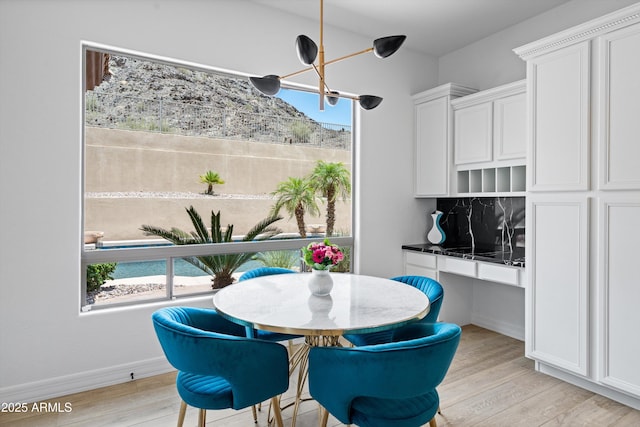 2722 W Hiddenview Dr, Phoenix, AZ 85045 - dining room featuring light wood-style floors and baseboards
