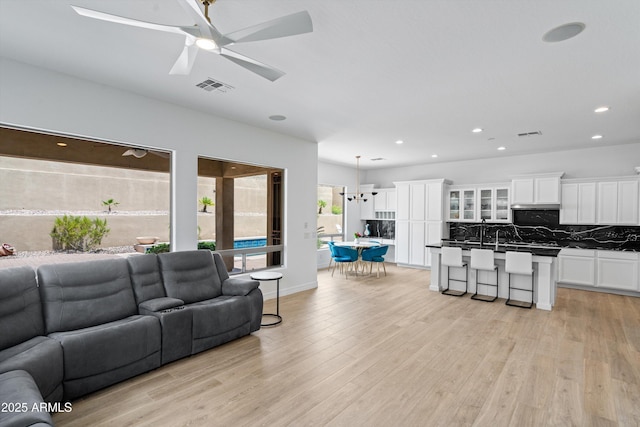 2722 W Hiddenview Dr, Phoenix, AZ 85045 - living area featuring light wood-style floors, recessed lighting, ceiling fan, and baseboards