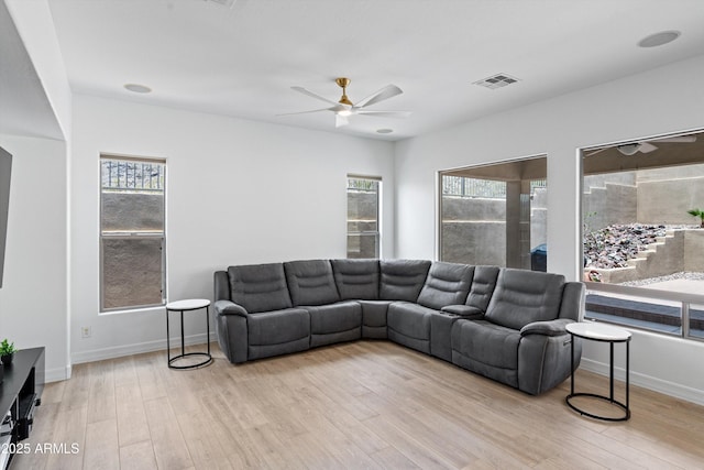 2722 W Hiddenview Dr, Phoenix, AZ 85045 - living area with ceiling fan, wood finished floors, and baseboards