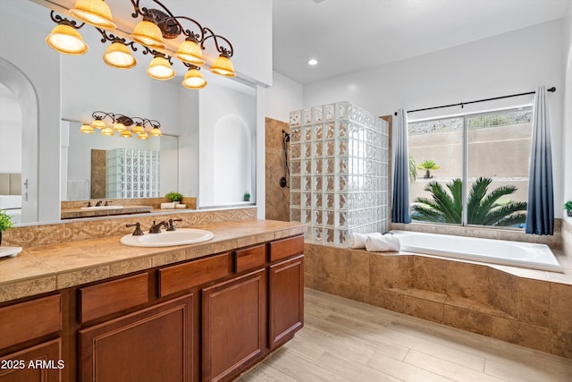 2722 W Hiddenview Dr, Phoenix, AZ 85045 - full bath featuring walk in shower, vanity, a bath, and wood finished floors