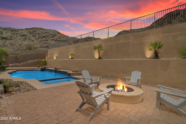 2722 W Hiddenview Dr, Phoenix, AZ 85045 - view of swimming pool featuring an outdoor fire pit, a patio area, a fenced backyard, and a mountain view