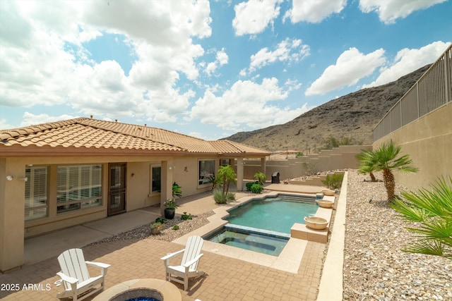 2722 W Hiddenview Dr, Phoenix, AZ 85045 - view of swimming pool with a patio area, a mountain view, an outdoor fire pit, a fenced backyard, and a pool with connected hot tub