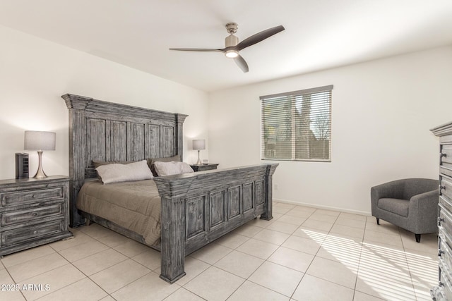 bedroom featuring light tile patterned floors, baseboards, and ceiling fan