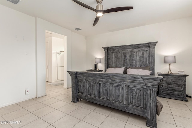 bedroom featuring light tile patterned floors, visible vents, baseboards, and a ceiling fan