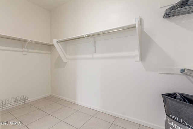 walk in closet featuring light tile patterned floors